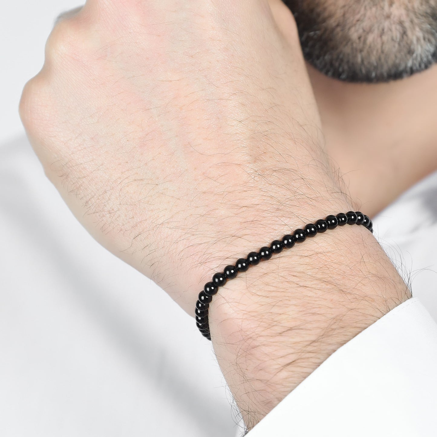 BRACCIALE UOMO IN ACCIAIO CON PERLE NERE