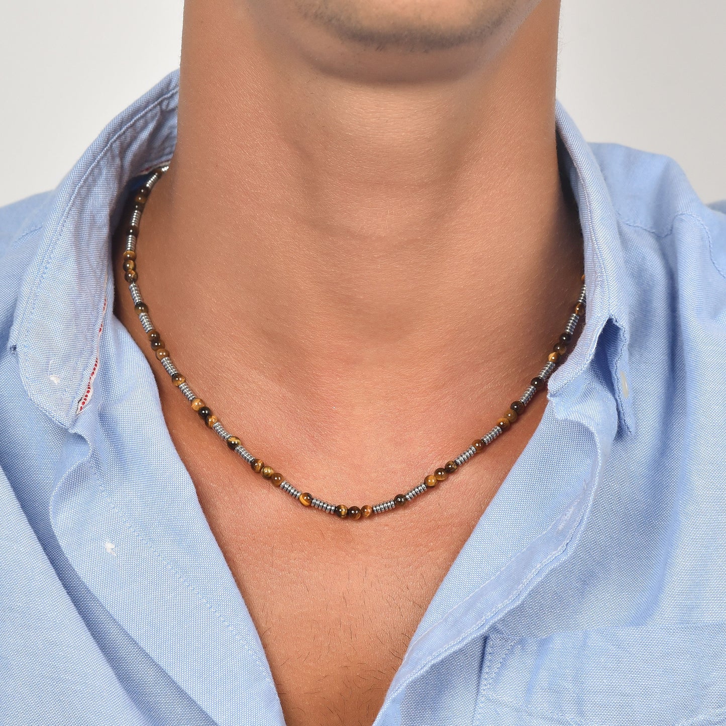 COLLANA UOMO IN ACCIAIO CON PIETRE OCCHIO DI TIGRE ED ELEMENTI IN ACCIAIO