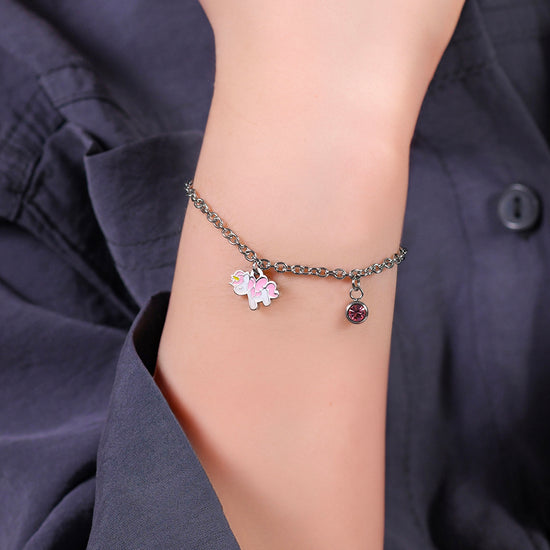 BRACCIALE BAMBINA IN ACCIAIO CON UNICORNO CON SMALTO ROSA E BIANCO E CRISTALLO