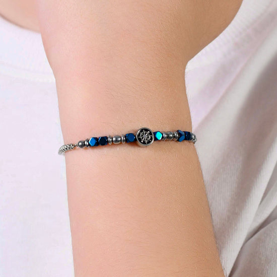 BRACCIALE BAMBINO IN ACCIAIO CON EMATITE BLU E TIMONE